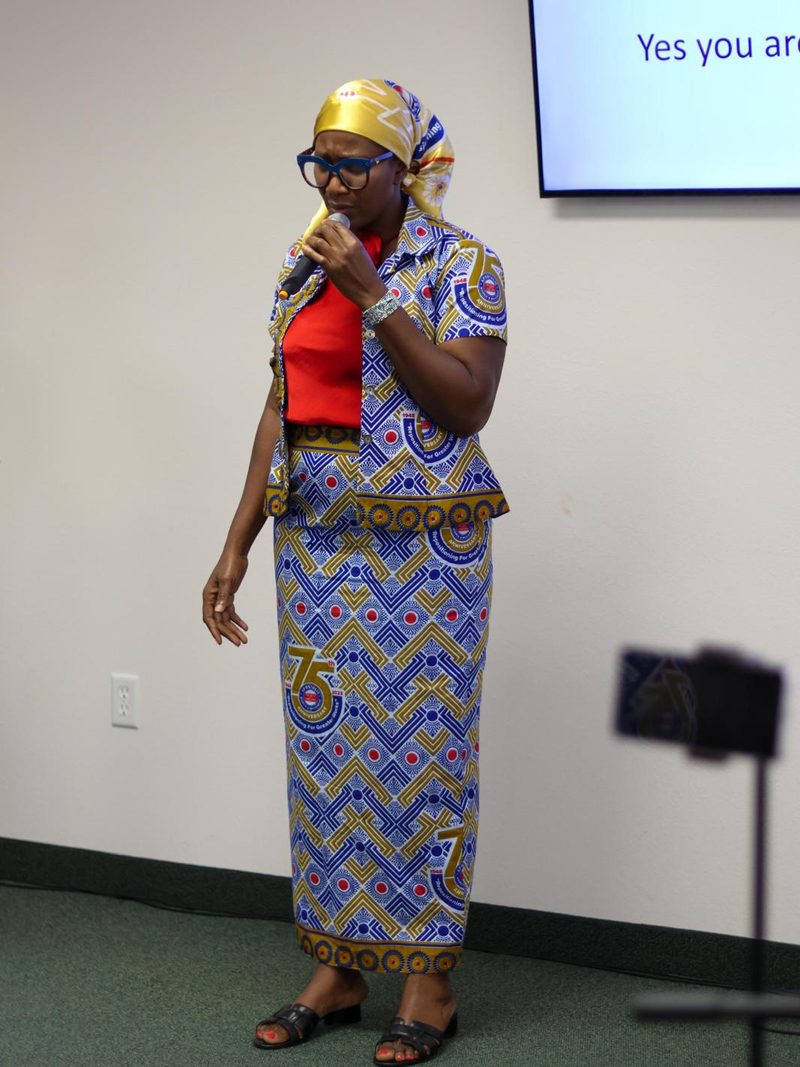 A member of the assembly speaking to the congregation during a service.