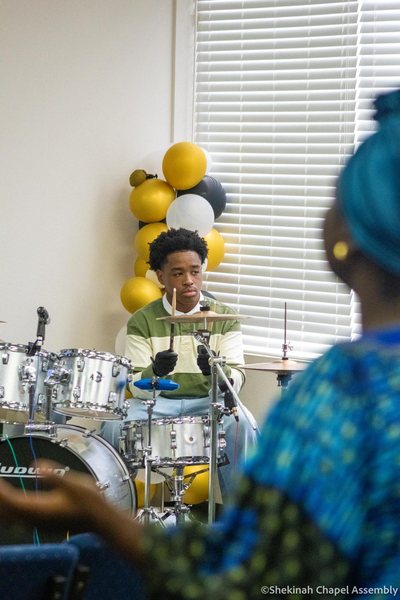 Keeping time on the drums.